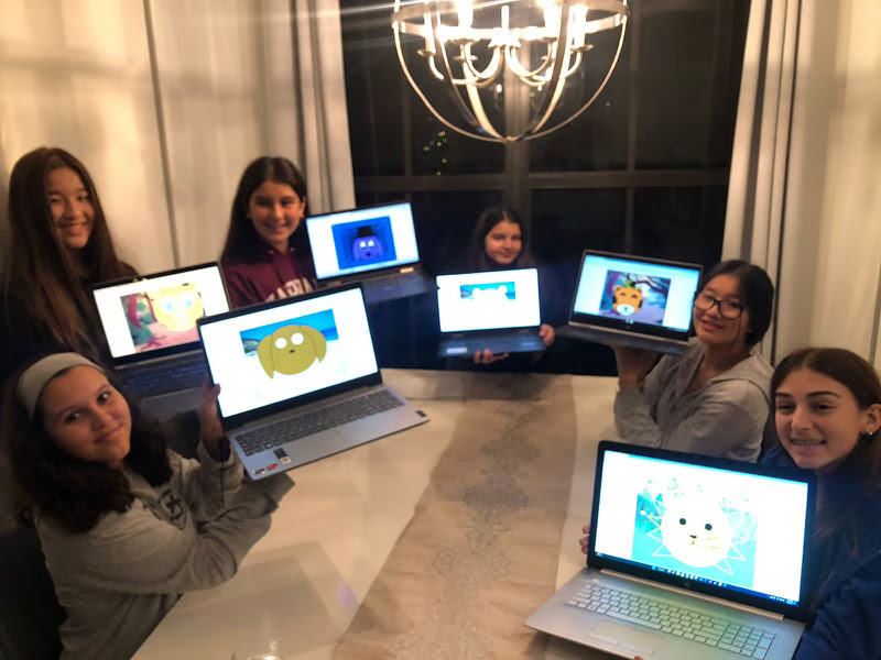 Girls showing coding projects